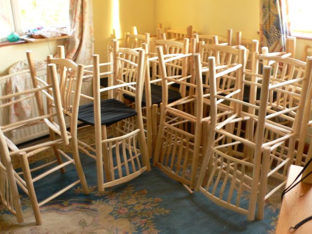 Two dozen lath-back chairs